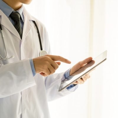 Medical physician doctor man over white background. Medicine and health care concept